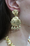 gold petal earrings with larger petal and small charm drops