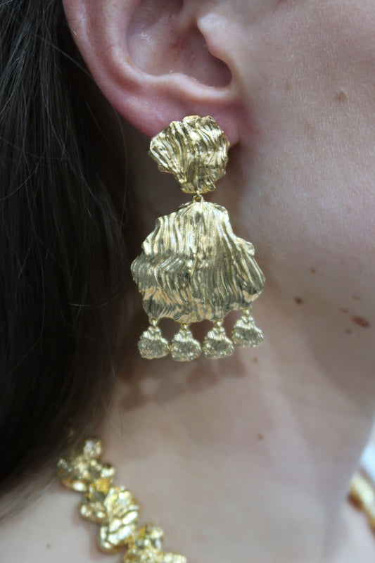 gold petal earrings with larger petal and small charm drops