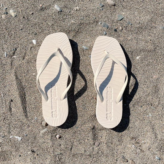 Square toe beige rubber flip flops from sleepers 