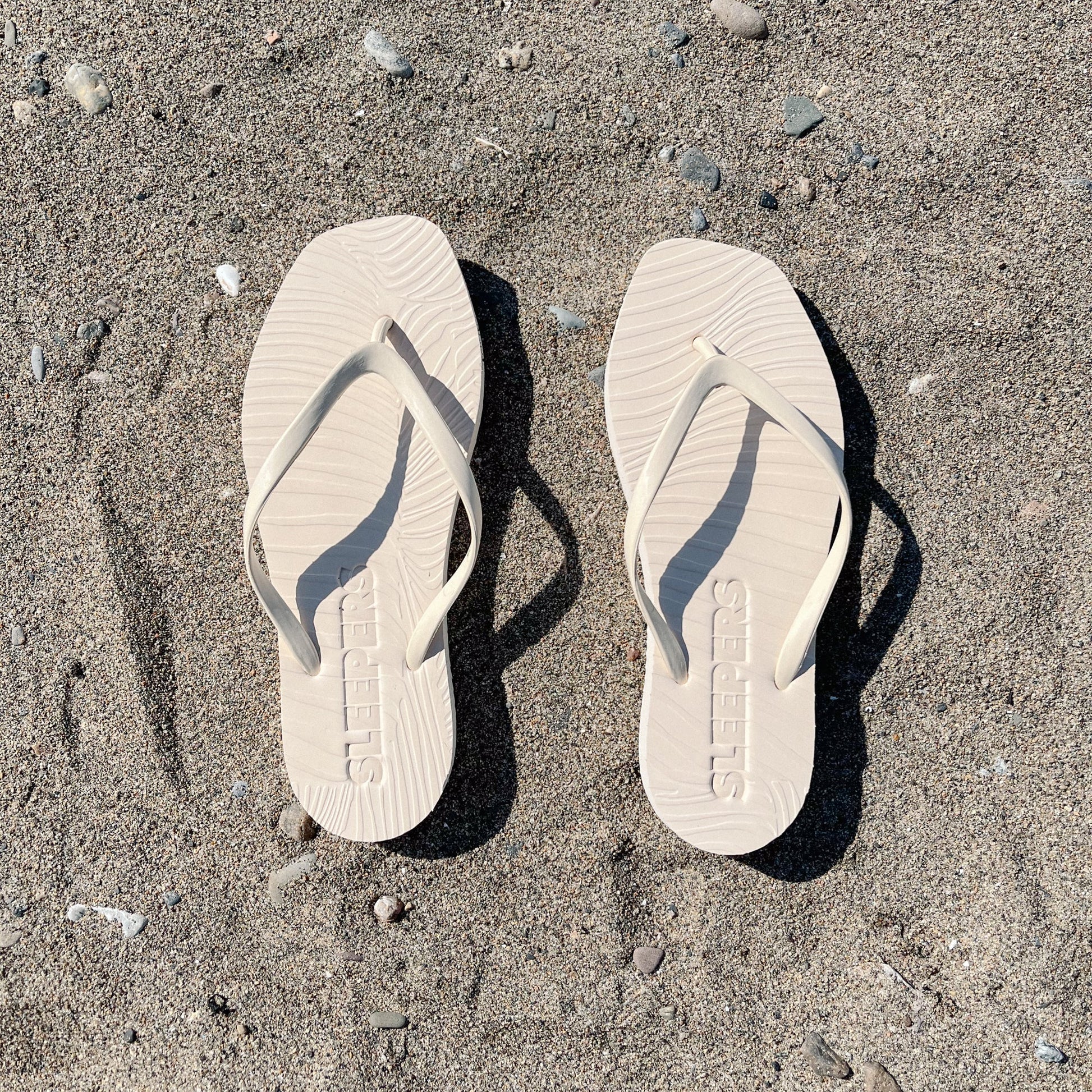 Square toe beige rubber flip flops from sleepers 