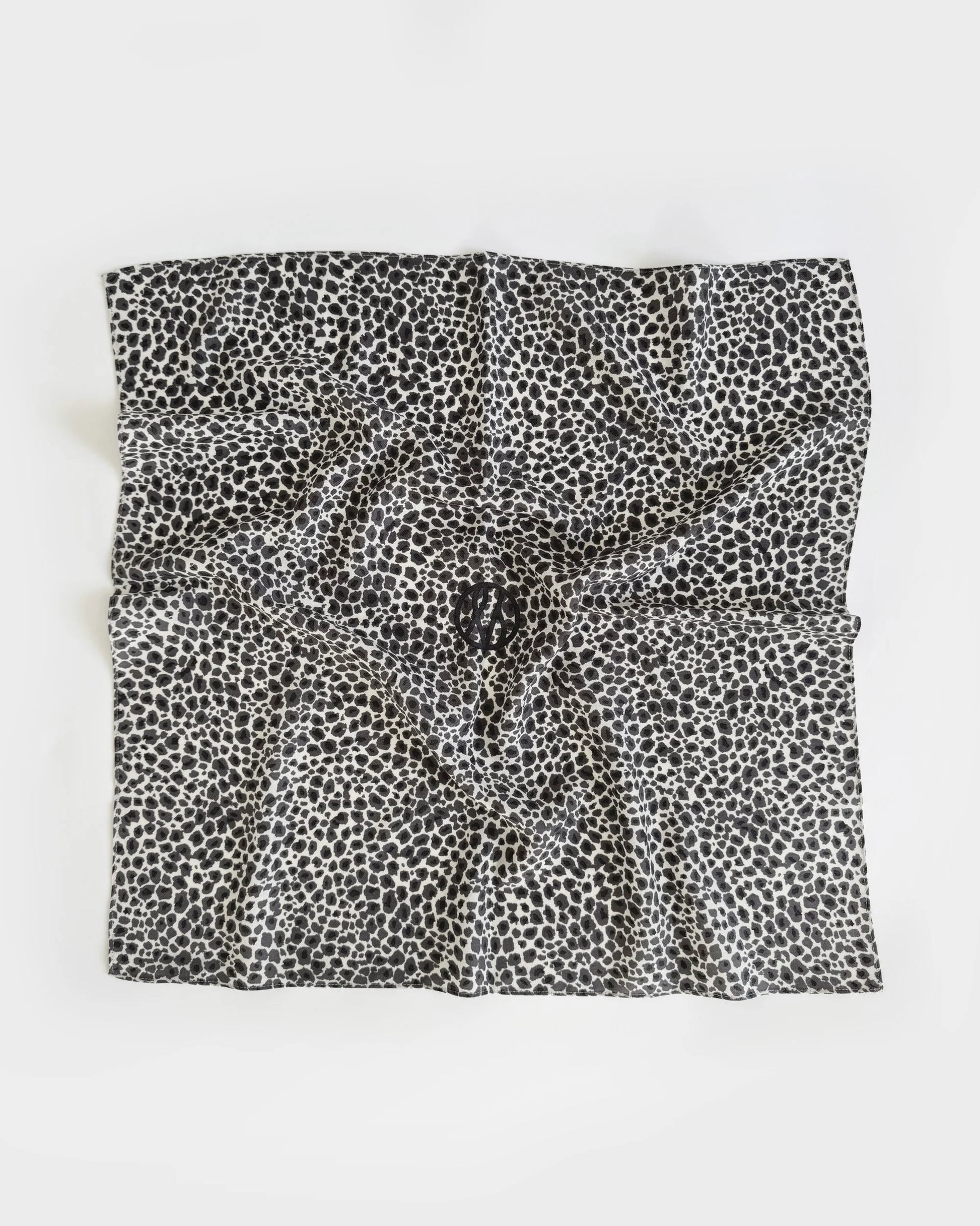 Black and white patterned fabric square on a white background