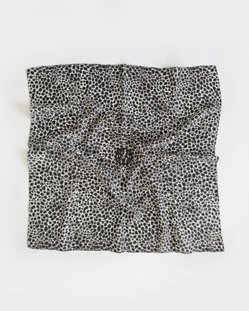 Black and white patterned fabric square on a white background