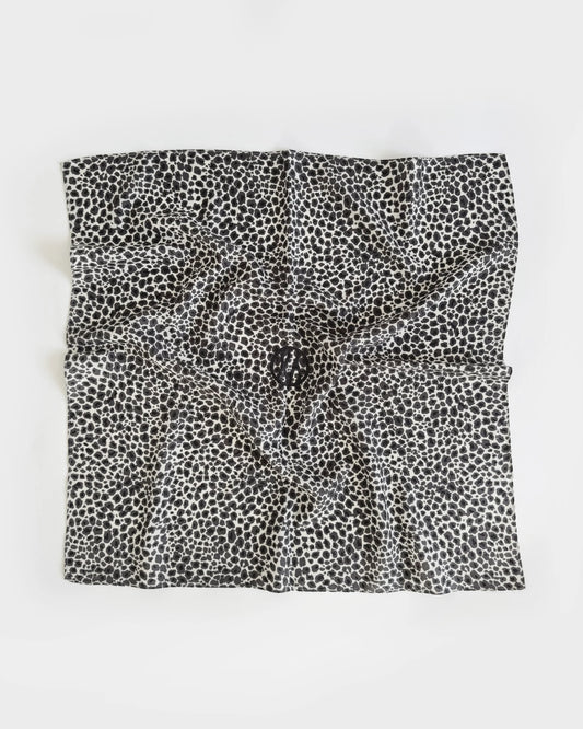 Black and white patterned fabric square on a white background