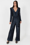 navy sequin jumpsuit with v neck, long sleeves and shoulder pads