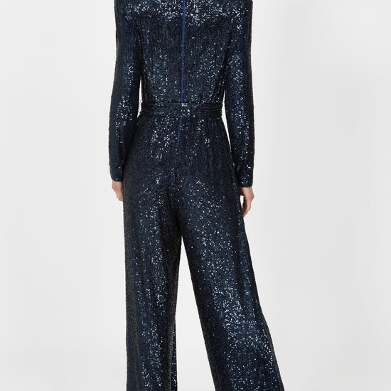 navy sequin jumpsuit with v neck, long sleeves and shoulder pads rear view 