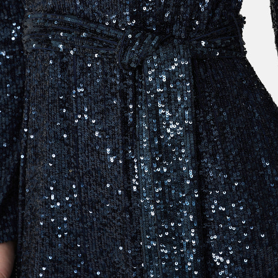 navy sequin jumpsuit with v neck, long sleeves and shoulder pads close up