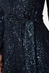 navy sequin jumpsuit with v neck, long sleeves and shoulder pads close up