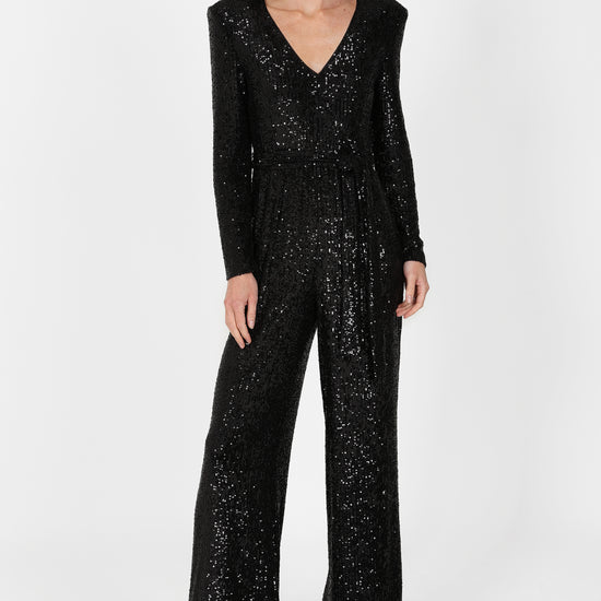 black sequin jumpsuit with v neck and wide leg with shoulder pads