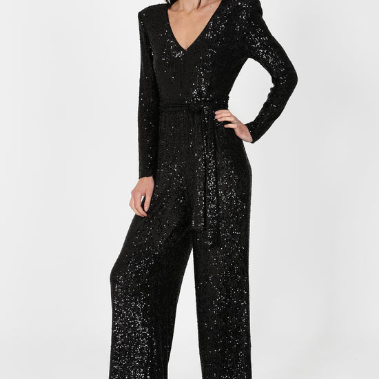 black sequin jumpsuit with v neck and wide leg with shoulder pads