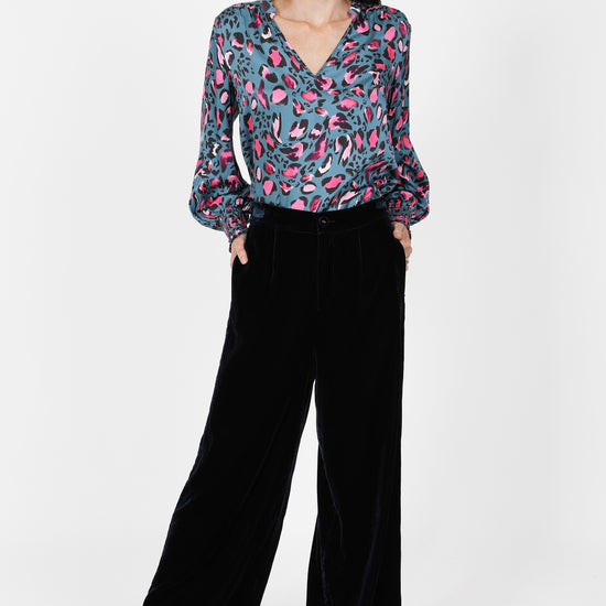 navy velvet wide leg trousers with elasticated rear waist   model shot