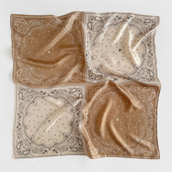 square silk scarf separated into quarters with paisley print in beige and tan from lescarf