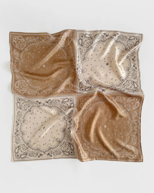 square silk scarf separated into quarters with paisley print in beige and tan from lescarf