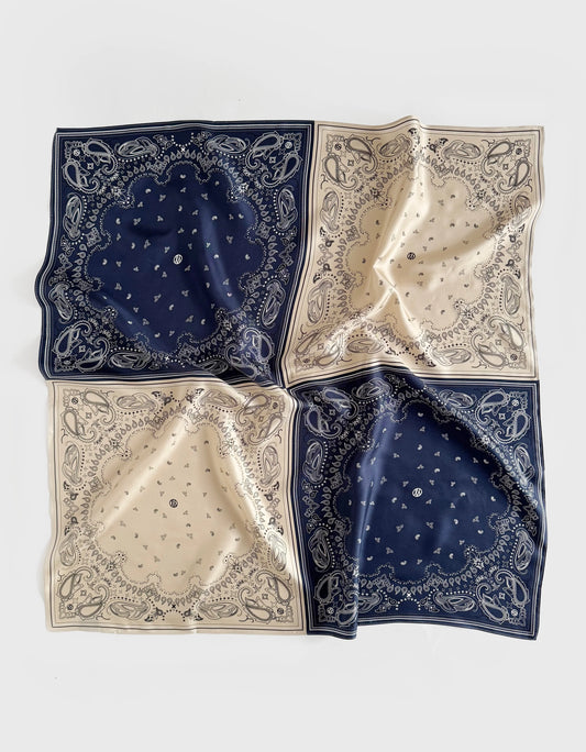 silk scarf with paisley print which has been separated into quarters in navy and beige from lescarf