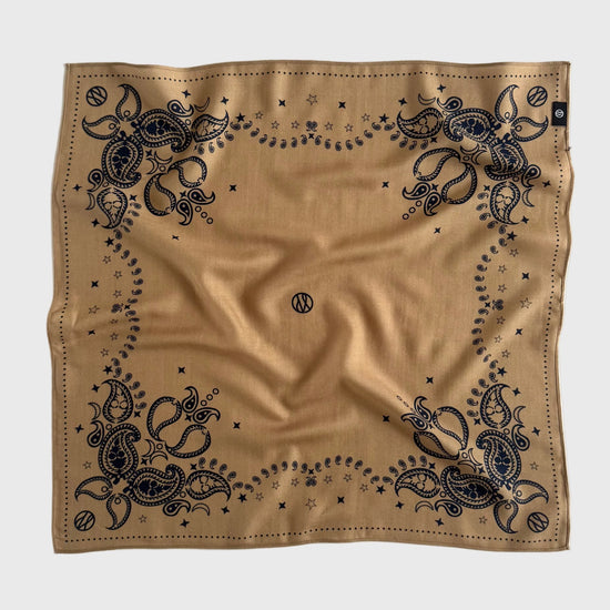 Beige bandana with navy intricate patterns on a white background in a wool silk blend from lescarf