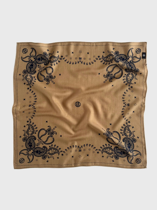 Beige bandana with navy intricate patterns on a white background in a wool silk blend from lescarf