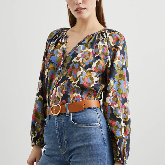 Floral print top with a half button placket and long sleeves closer shot