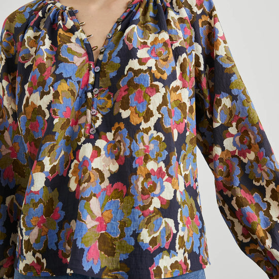 Floral print top with a half button placket and long sleeves