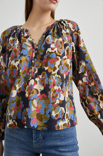 Floral print top with a half button placket and long sleeves