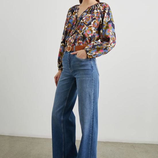 Floral print top with a half button placket and long sleeves model shot