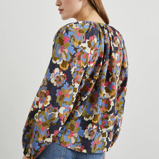 Floral print top with a half button placket and long sleeves rear view