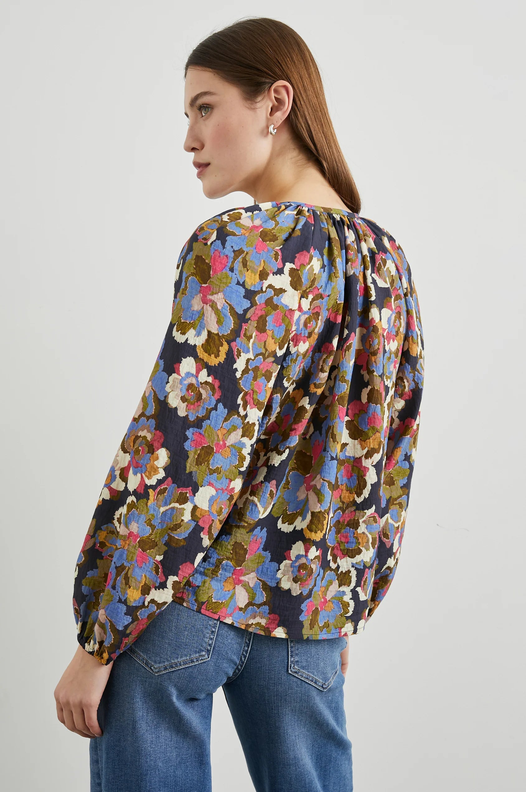 Floral print top with a half button placket and long sleeves rear view