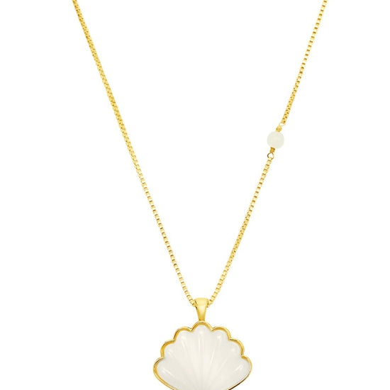 gold necklace on chain with a white pearl shell pendant