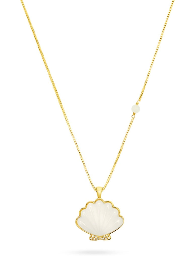gold necklace on chain with a white pearl shell pendant
