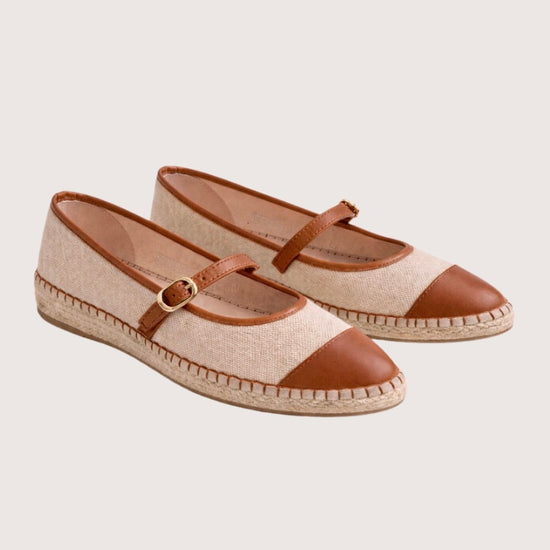 Beige flat shoe with tan cap-toe and woven sole 