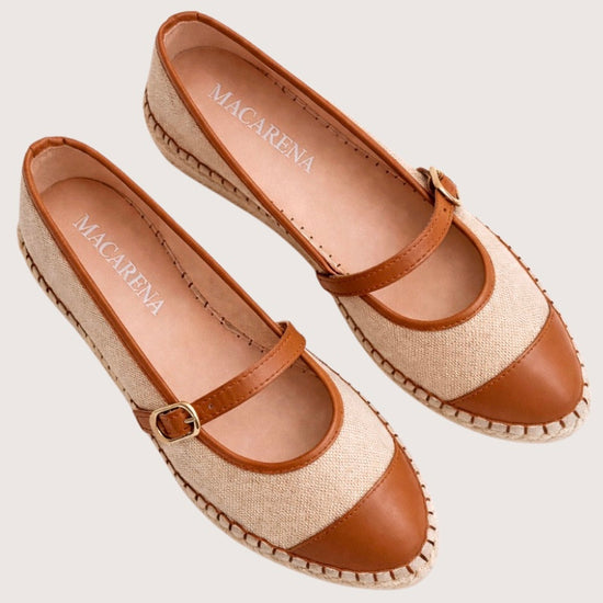 Beige flat shoe with tan cap-toe and woven sole 