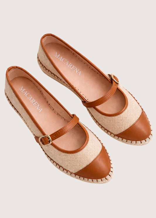 Beige flat shoe with tan cap-toe and woven sole 