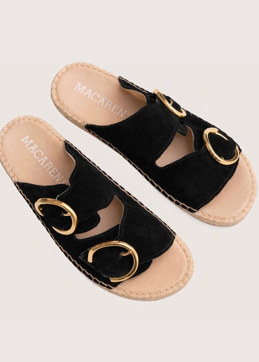 Black suede sandal with gold buckles and an espadrille sole 