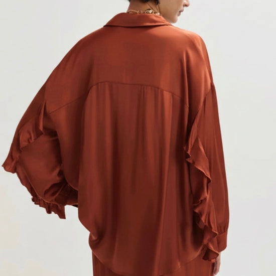 copper satin shirt on a white background