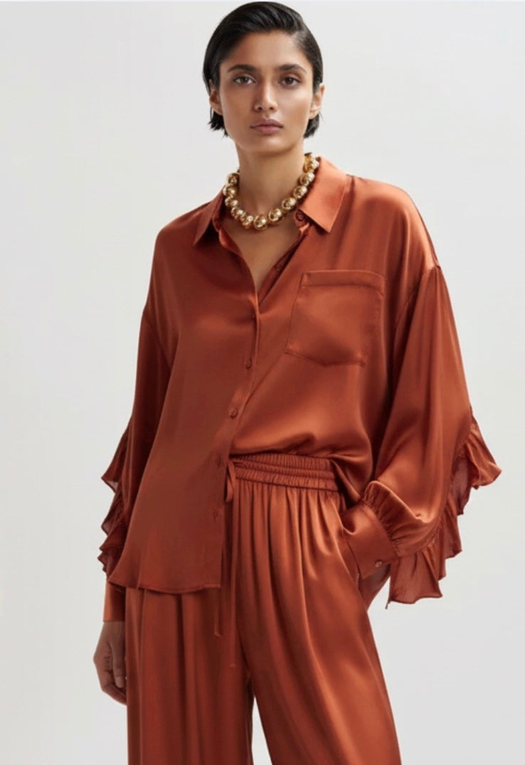 copper satin shirt on a white background
