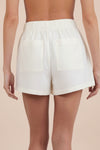 white pleated shorts