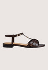 Brown sandal with a thin strap on a light gray background