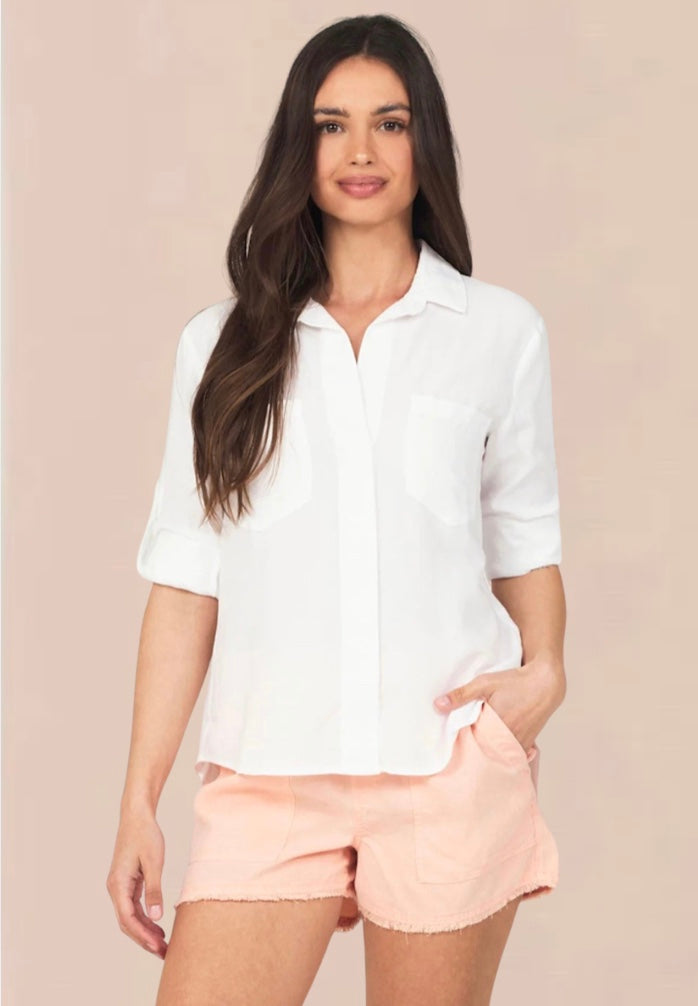 White shirt with classic colalr and covered placket with turn up cuffs and two front chest pockets