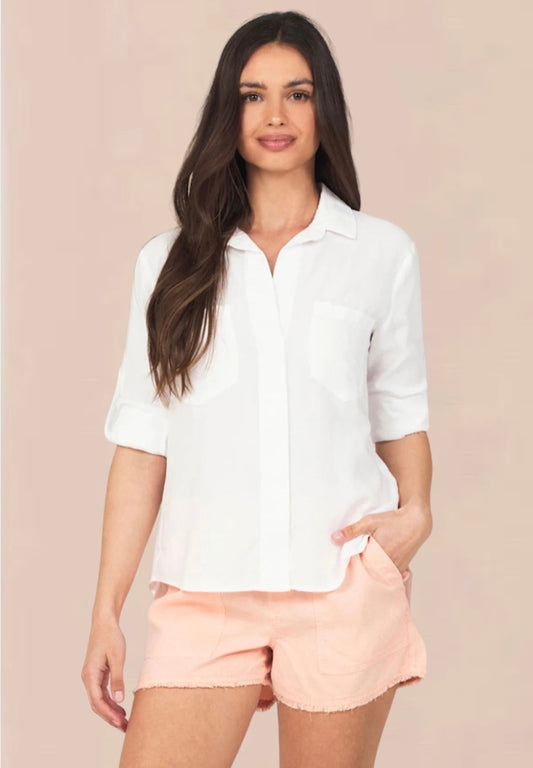 White shirt with classic colalr and covered placket with turn up cuffs and two front chest pockets