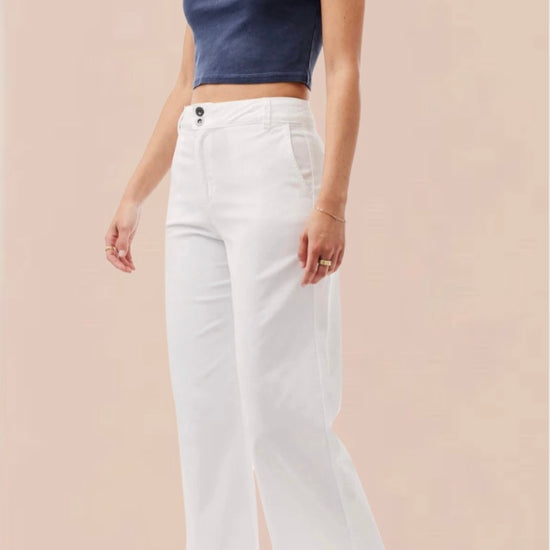 White cropped wide leg trousers with double button and zip fastening with slant side pockets and back patch pockets