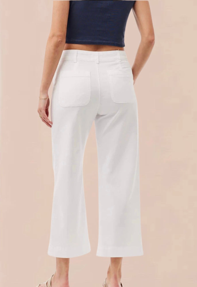 White cropped wide leg trousers with double button and zip fastening with slant side pockets and back patch pockets