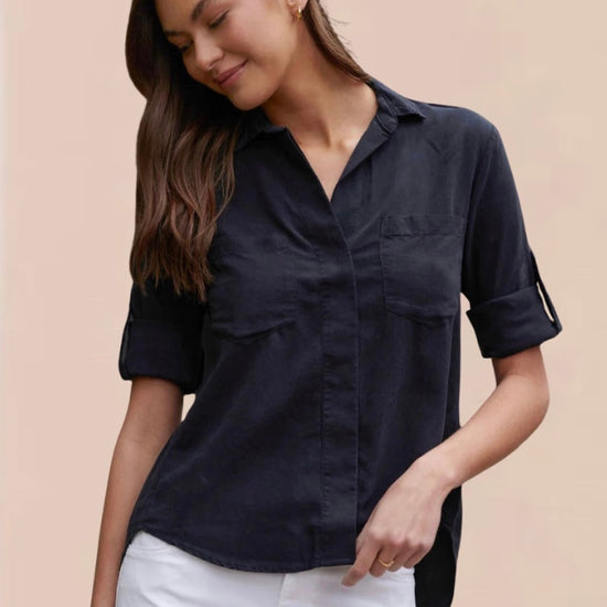 Black shirt with two chest pockets roll up arms classic collar and split back hem