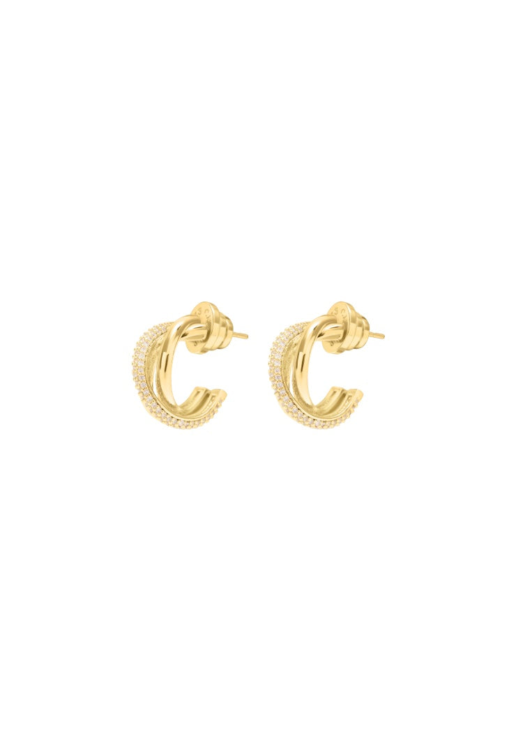 A pair of gold huggie hoop earrings with cz stones and a cross over style 