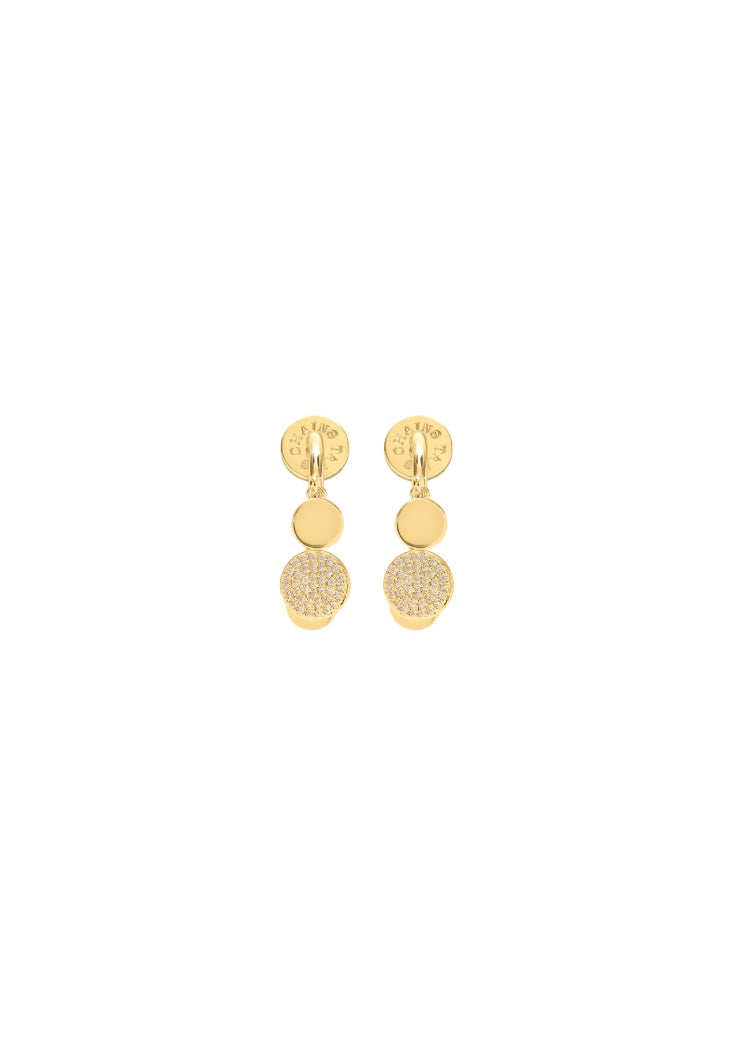 A pair of gold dangle earrings with a textured disc, a solid gold disc, and a small gold disc at the bottom.