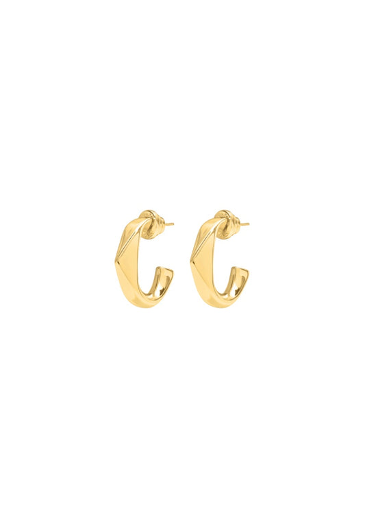 A pair of gold huggie hoop earrings with a textured, ribbed surface.