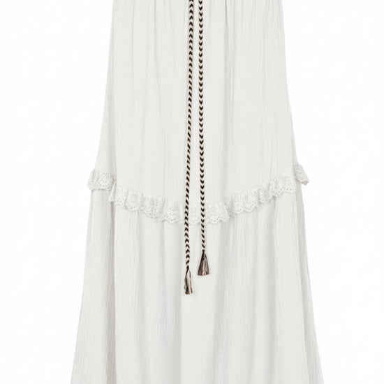 White skirt with a decorative belt on a white background