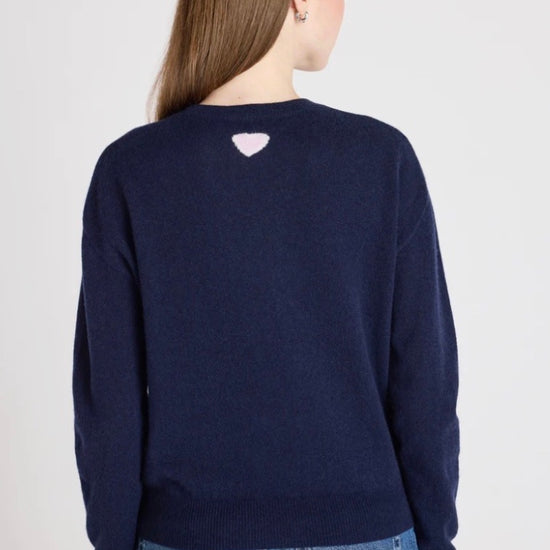 model shot from the rear of navy jumper on a white background