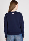 model shot from the rear of navy jumper on a white background