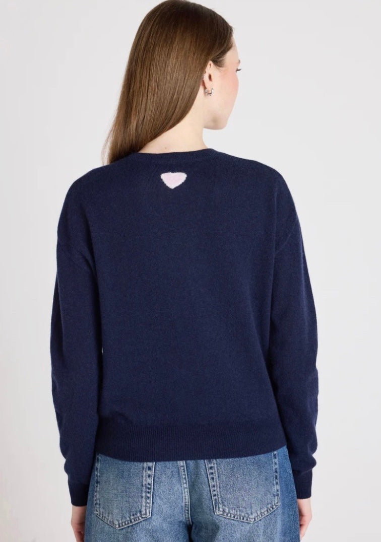 model shot from the rear of navy jumper on a white background