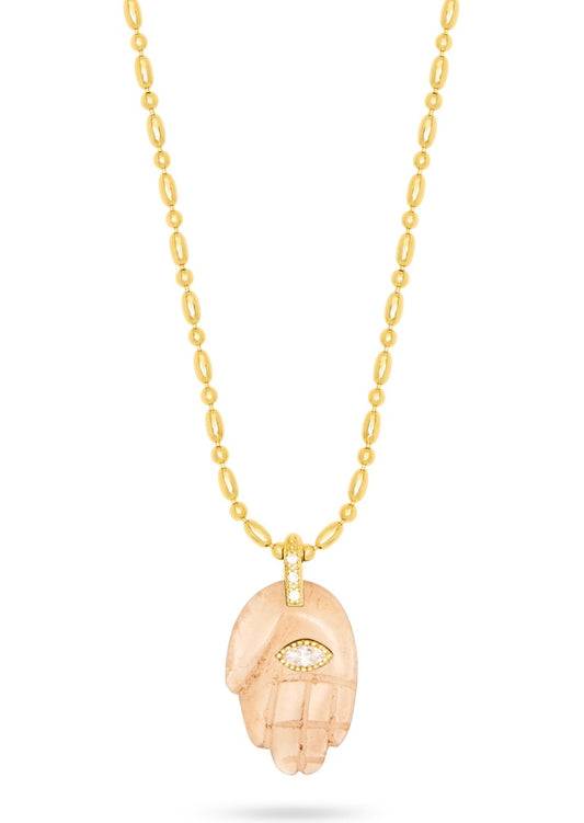textured gold chain with protective hand pendent in a smokey quartz colour