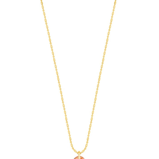 textured gold chain with protective hand pendent in a red quartz colour