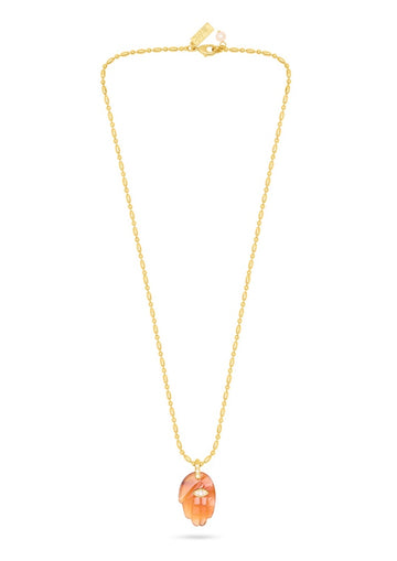 textured gold chain with protective hand pendent in a red quartz colour
